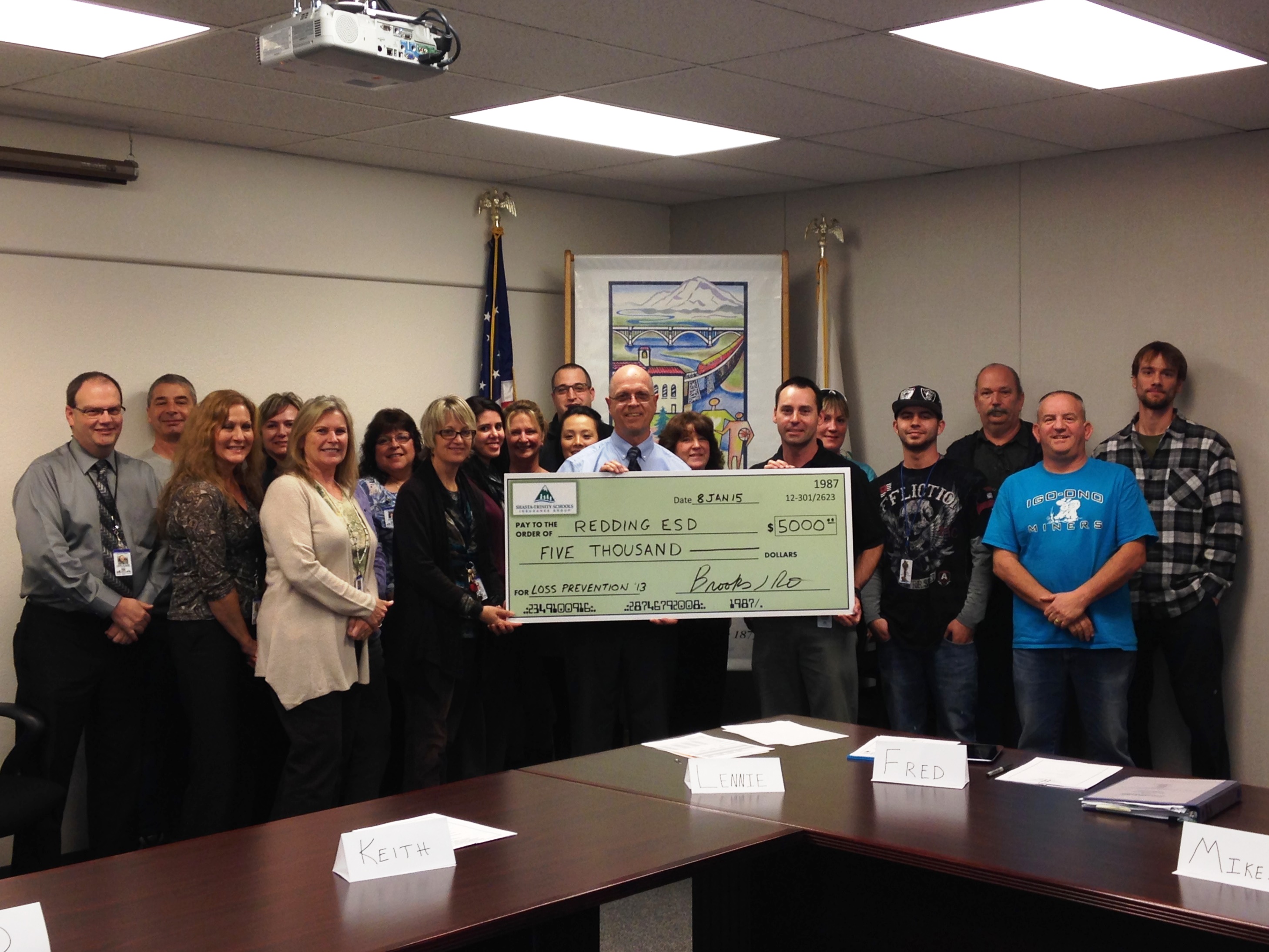 Employees of Redding Elementary with large check